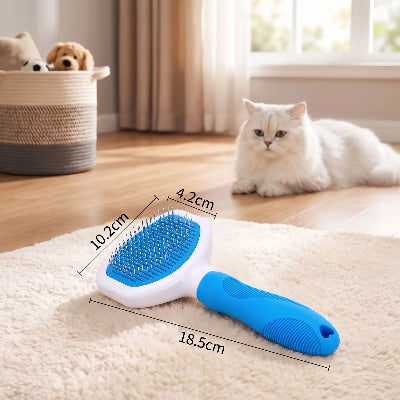Brosse pour chat grand modèle à manche bleu et tête blanche, posée sur une table avec ses dimensions indiquées